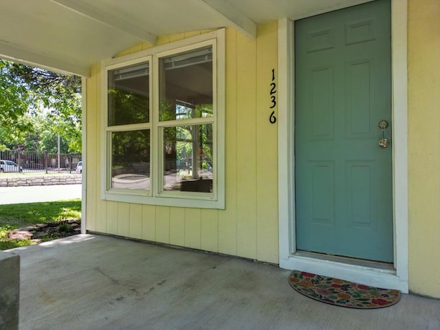 1230 W Mount Comfort Rd, Fayetteville, AR 72703 - view of exterior entry with fence and a patio area