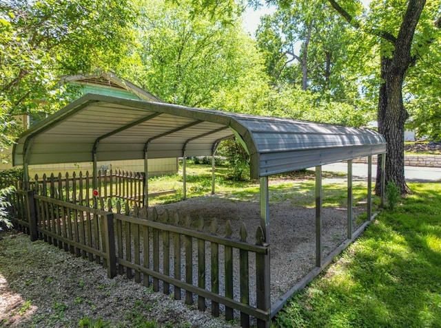 1230 W Mount Comfort Rd, Fayetteville, AR 72703 - view of vehicle parking with fence and a detached carport