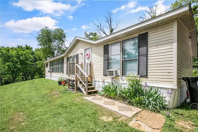 14650 Mariano Rd, Bentonville, AR 72712 - view of front of house with a front yard and cooling unit