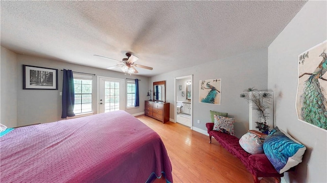 12526 Avoca Hollow Rd, Garfield, AR 72732 - bedroom with light wood finished floors, a textured ceiling, a ceiling fan, access to exterior, and ensuite bathroom