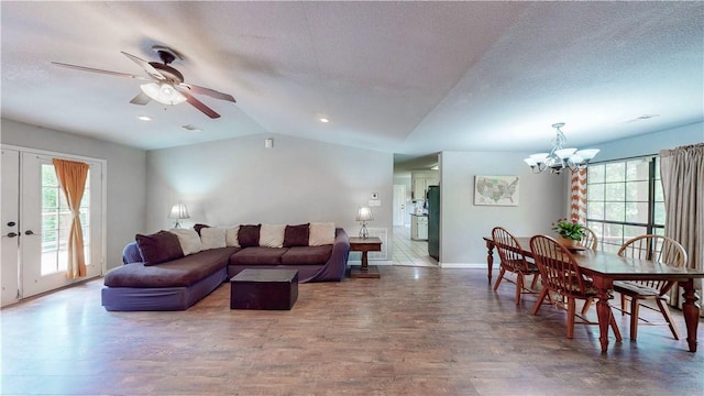 12526 Avoca Hollow Rd, Garfield, AR 72732 - living room with lofted ceiling, healthy amount of natural light, ceiling fan, a chandelier, and baseboards
