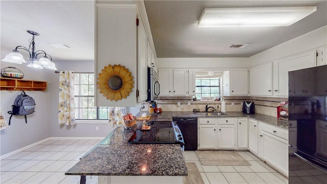 12526 Avoca Hollow Rd, Garfield, AR 72732 - kitchen with black appliances, light tile patterned floors, a sink, tasteful backsplash, and dark stone countertops