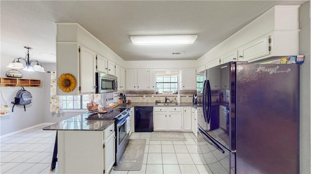 12526 Avoca Hollow Rd, Garfield, AR 72732 - kitchen with black appliances, light tile patterned floors, white cabinetry, backsplash, and a sink