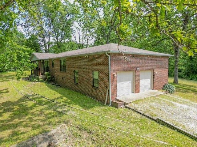 12526 Avoca Hollow Rd, Garfield, AR 72732 - view of property exterior with driveway, a yard, brick siding, and an attached garage