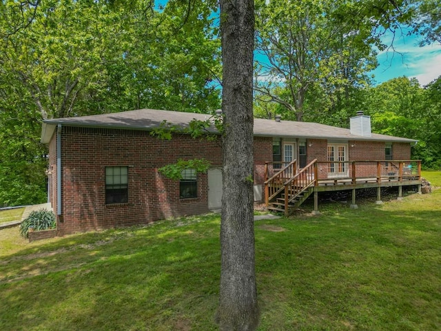12526 Avoca Hollow Rd, Garfield, AR 72732 - rear view of property featuring brick siding, a wooden deck, a chimney, a yard, and french doors