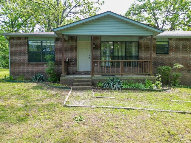 12526 Avoca Hollow Rd, Garfield, AR 72732 - view of front of home featuring a porch, brick siding, and a front lawn