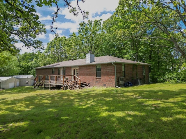 12526 Avoca Hollow Rd, Garfield, AR 72732 - rear view of property with brick siding, a wooden deck, a chimney, and a lawn