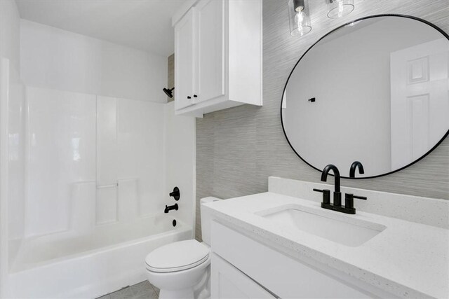 12391 Shamrock Rd, Farmington, AR 72730 - bathroom featuring toilet, shower / bath combination, and vanity