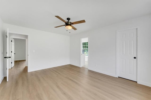 12391 Shamrock Rd, Farmington, AR 72730 - unfurnished room with a ceiling fan, light wood-style floors, and baseboards
