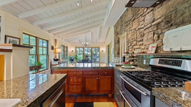 kitchen with appliances with stainless steel finishes, wood ceiling, dark wood finished floors, brown cabinetry, and a chandelier