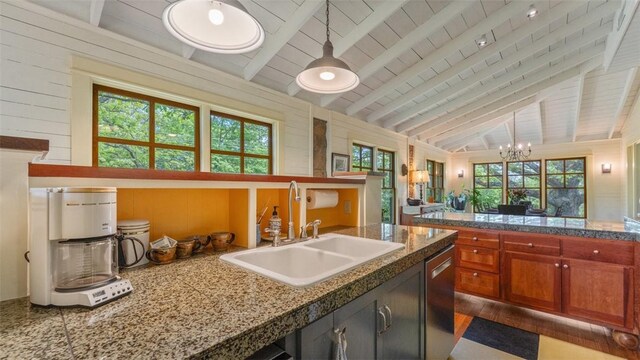 kitchen featuring a sink, wood ceiling, stainless steel dishwasher, a chandelier, and tile counters