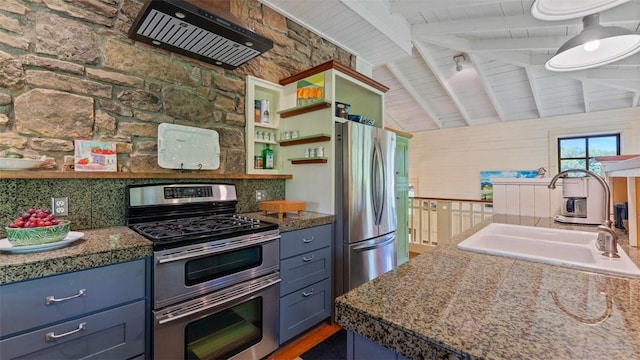 kitchen with appliances with stainless steel finishes, a sink, blue cabinetry, and open shelves