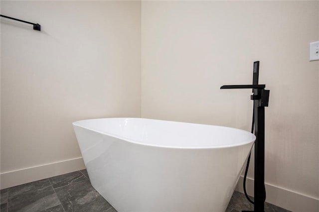 25 Lathrop Dr, Bella Vista, AR 72715 - full bath with a freestanding bath, baseboards, and marble finish floors