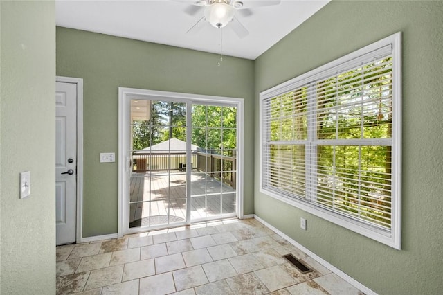 6 Rivercliff Rd, Rogers, AR 72756 - unfurnished sunroom featuring a ceiling fan