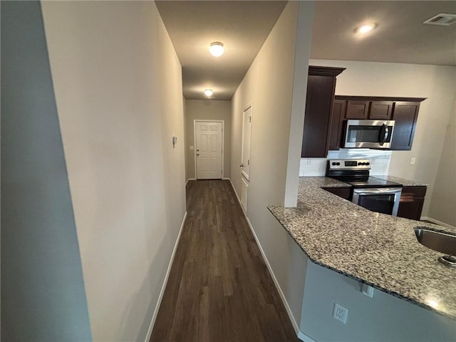 811 Belhaven Rd, Centerton, AR 72719 - hall with dark wood finished floors and baseboards