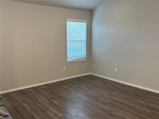811 Belhaven Rd, Centerton, AR 72719 - spare room featuring baseboards and dark wood-type flooring