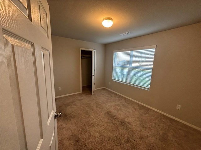 811 Belhaven Rd, Centerton, AR 72719 - unfurnished bedroom featuring carpet floors and baseboards