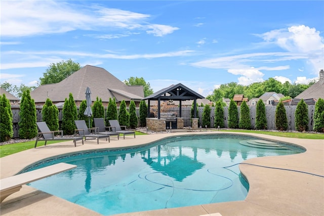 6503 S 35th St, Rogers, AR 72758 - view of swimming pool with a gazebo, a fenced backyard, an outdoor kitchen, a patio, and a diving board