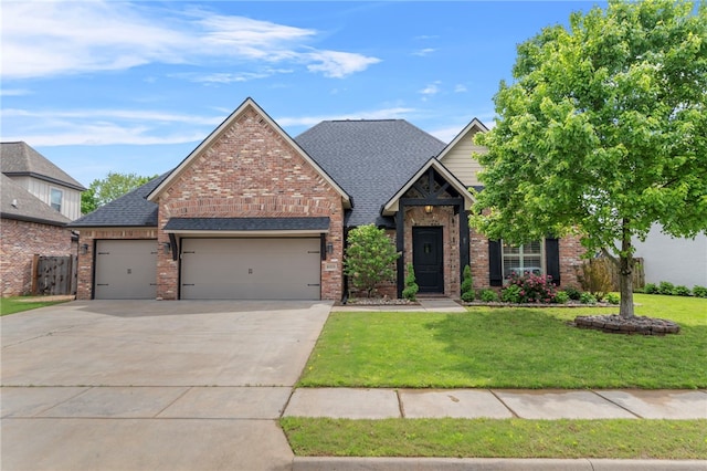 6503 S 35th St, Rogers, AR 72758 - view of front facade with an attached garage, concrete driveway, a front lawn, and brick siding