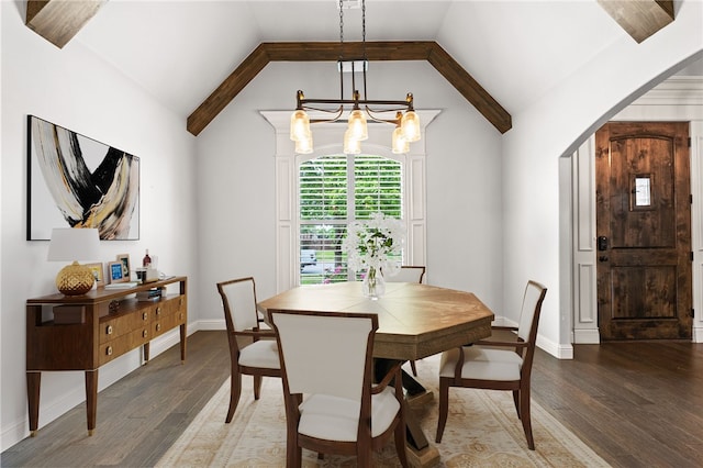 6503 S 35th St, Rogers, AR 72758 - dining area with a chandelier, wood finished floors, vaulted ceiling, baseboards, and arched walkways
