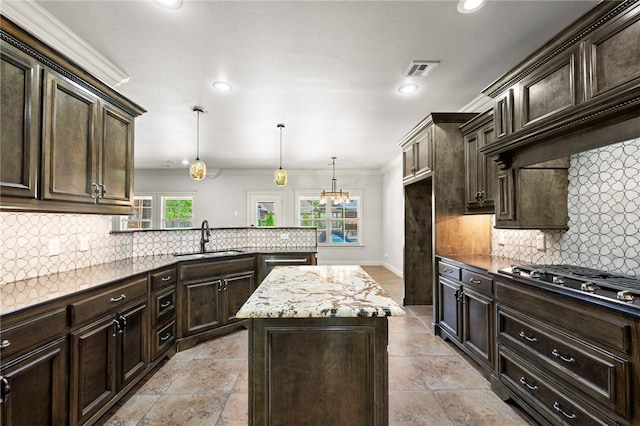 6503 S 35th St, Rogers, AR 72758 - kitchen with a sink, stainless steel appliances, ornamental molding, recessed lighting, and dark brown cabinetry
