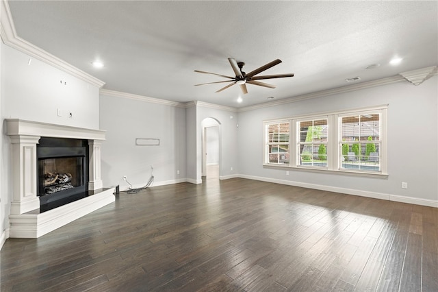 6503 S 35th St, Rogers, AR 72758 - unfurnished living room featuring a ceiling fan, arched walkways, a fireplace with raised hearth, dark wood-style floors, and baseboards