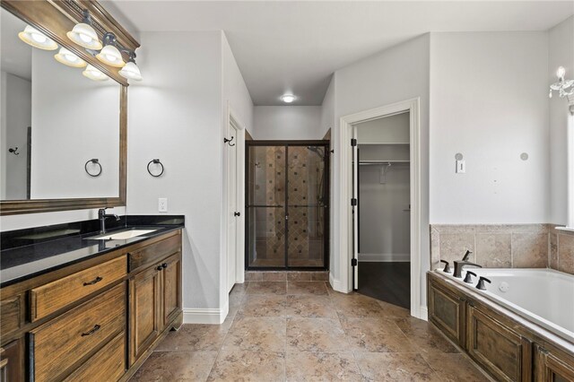 6503 S 35th St, Rogers, AR 72758 - full bath featuring a shower stall, baseboards, a bath, a spacious closet, and vanity