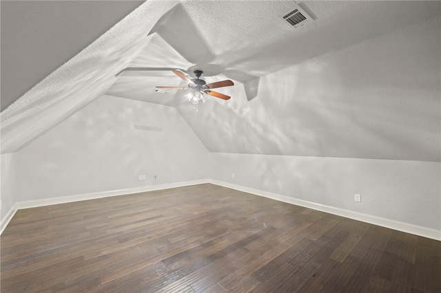 6503 S 35th St, Rogers, AR 72758 - bonus room with baseboards, lofted ceiling, a textured ceiling, a ceiling fan, and wood finished floors