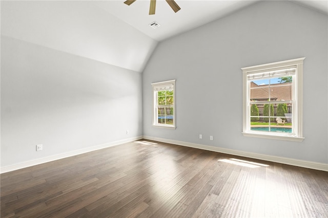 6503 S 35th St, Rogers, AR 72758 - empty room with lofted ceiling, ceiling fan, dark wood-type flooring, and baseboards