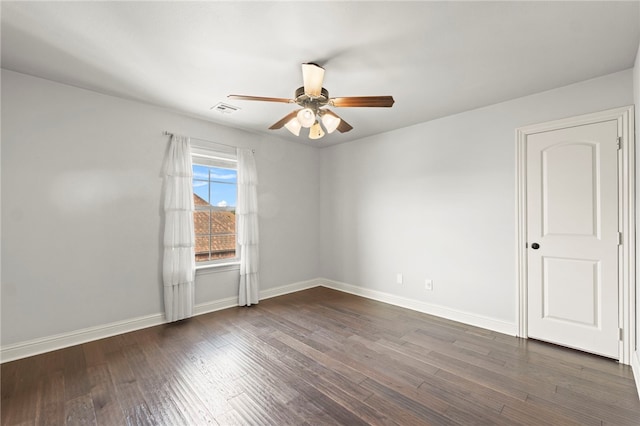 6503 S 35th St, Rogers, AR 72758 - spare room featuring ceiling fan, baseboards, and dark wood-type flooring