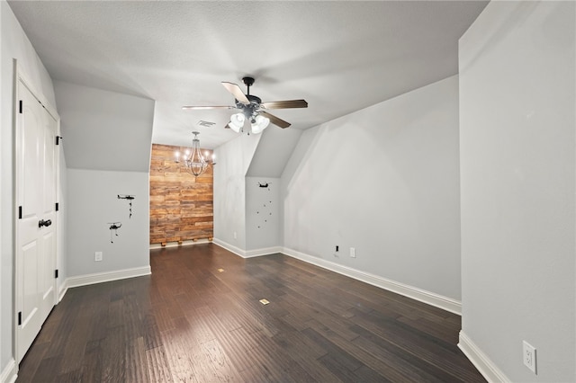 6503 S 35th St, Rogers, AR 72758 - bonus room with a ceiling fan, a chandelier, dark wood-style flooring, baseboards, and lofted ceiling