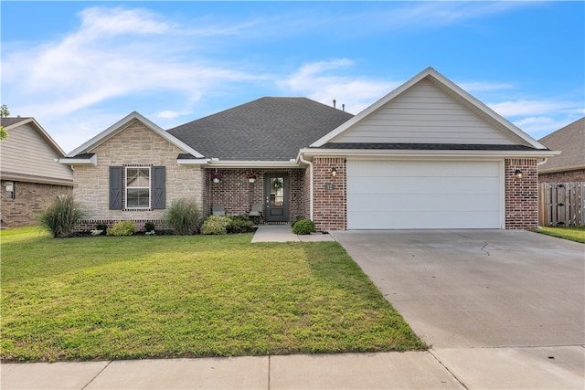 12 E Loveland Loop, Farmington, AR 72730 - view of front of home with an attached garage, driveway, brick siding, and roof with shingles