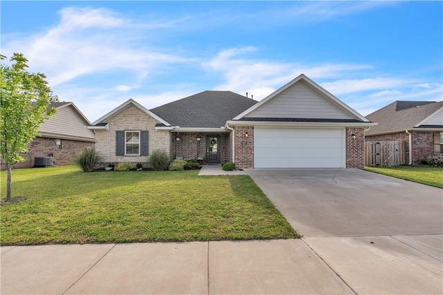 12 E Loveland Loop, Farmington, AR 72730 - view of front of property with an attached garage, concrete driveway, central air condition unit, and brick siding