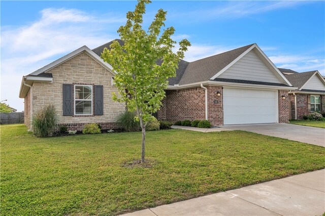 12 E Loveland Loop, Farmington, AR 72730 - view of front of property with driveway, a garage, stone siding, and brick siding