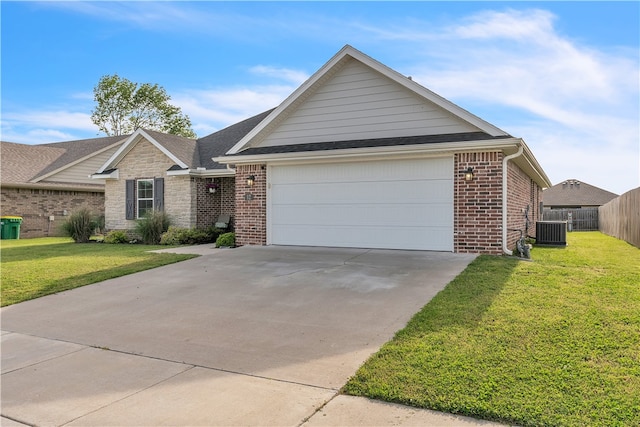 12 E Loveland Loop, Farmington, AR 72730 - ranch-style house with central AC unit, brick siding, driveway, and a garage