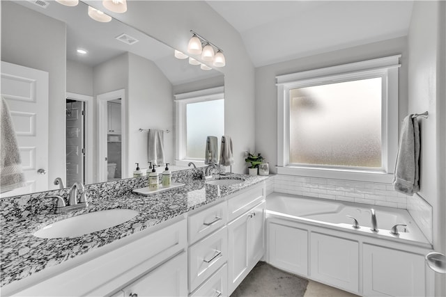 12 E Loveland Loop, Farmington, AR 72730 - bathroom featuring vaulted ceiling, double vanity, and a bath