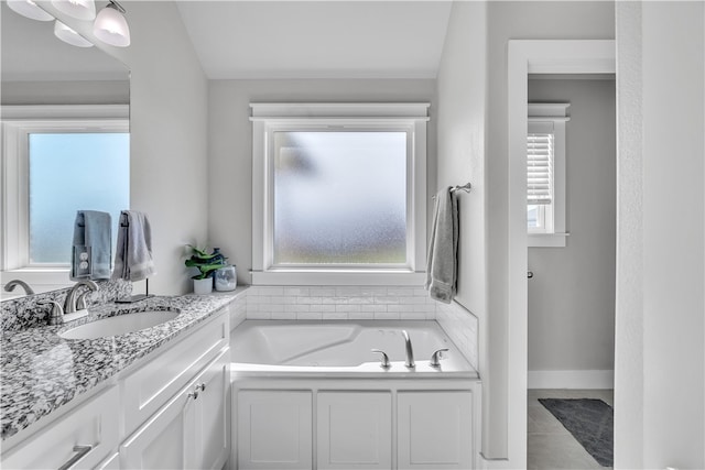 12 E Loveland Loop, Farmington, AR 72730 - full bathroom with vanity, a garden tub, and tile patterned flooring