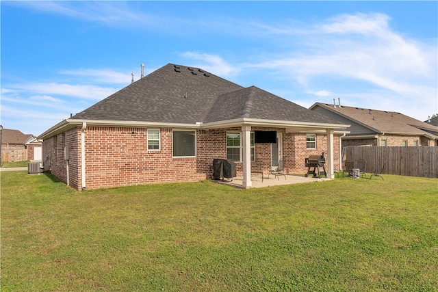 12 E Loveland Loop, Farmington, AR 72730 - rear view of house with a patio, brick siding, central AC unit, and roof with shingles