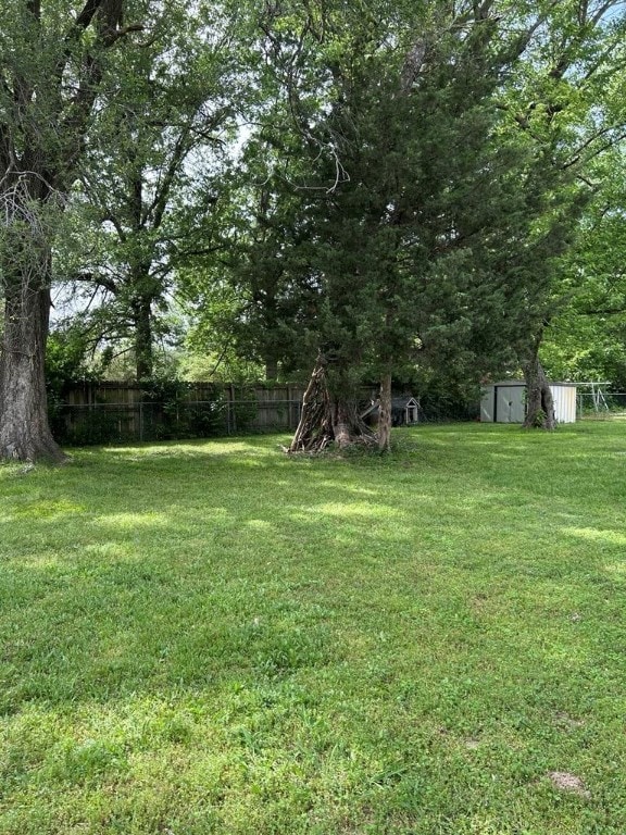 1002 N Pleasant St, Springdale, AR 72764 - view of yard featuring a storage shed and an outbuilding
