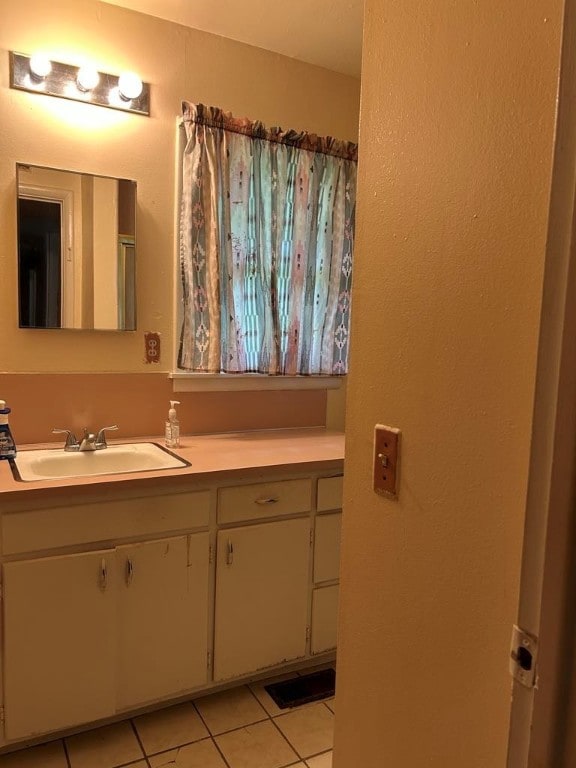 1002 N Pleasant St, Springdale, AR 72764 - bathroom with tile patterned floors and vanity