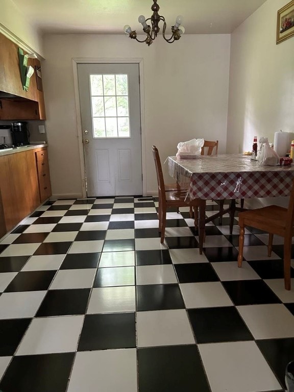 1002 N Pleasant St, Springdale, AR 72764 - dining space with a chandelier and light floors