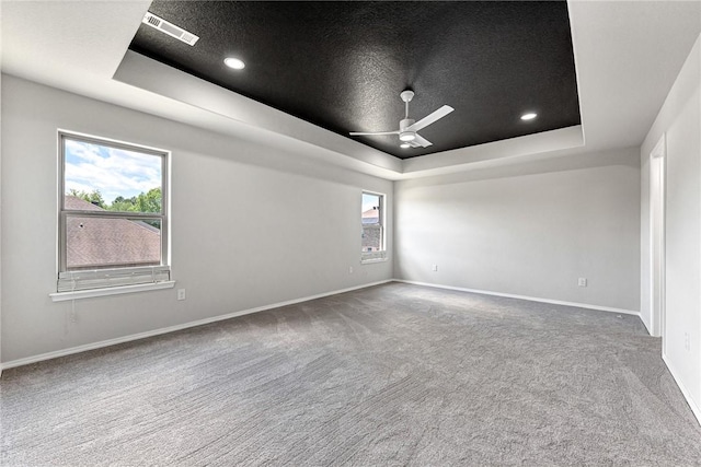 1302 Walker Dr, Rogers, AR 72756 - empty room featuring a tray ceiling, carpet, a ceiling fan, baseboards, and recessed lighting