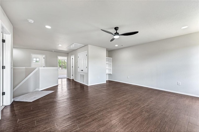 1302 Walker Dr, Rogers, AR 72756 - spare room with a ceiling fan, dark wood-style flooring, baseboards, attic access, and recessed lighting