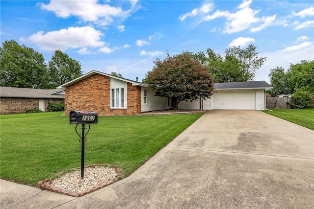 1801 Jean St, Springdale, AR 72762 - view of front of property featuring concrete driveway, an attached garage, and brick siding