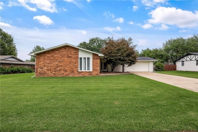 1801 Jean St, Springdale, AR 72762 - view of front of house with concrete driveway, brick siding, a front yard, and an attached garage