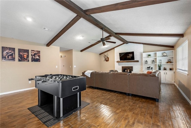 1801 Jean St, Springdale, AR 72762 - recreation room with a brick fireplace, ceiling fan, and dark wood-style floors