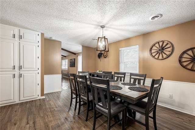 1801 Jean St, Springdale, AR 72762 - dining room featuring dark wood-style flooring, wainscoting, and a textured ceiling