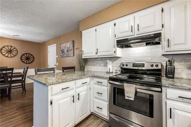 1801 Jean St, Springdale, AR 72762 - kitchen featuring stainless steel electric range, under cabinet range hood, a peninsula, white cabinets, and a textured ceiling