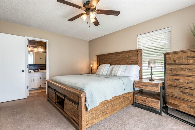 1801 Jean St, Springdale, AR 72762 - bedroom with light carpet, ensuite bathroom, ceiling fan, and a textured ceiling