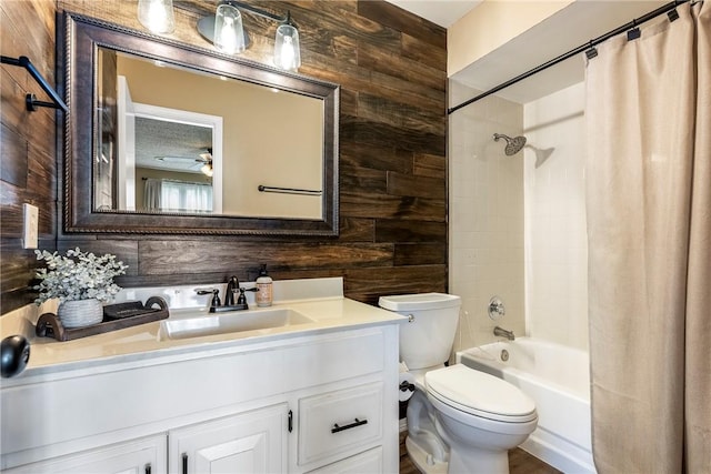 1801 Jean St, Springdale, AR 72762 - full bathroom with wood walls, shower / tub combo, vanity, and a ceiling fan